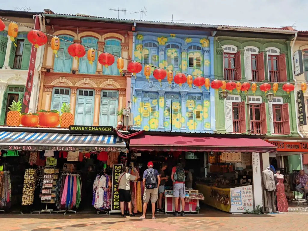 During your Singapore layover, stop by Chinatown to go shopping, see the colorful buildings, and eat street food.