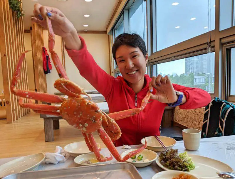 Seoul in 5 days: Jackie Szeto, Life Of Doing, holds up a cooked crab from Noryangjin Fish Market