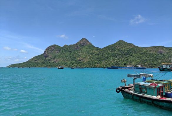 Con-Dao-Vietnam-Beautiful-Waters The turquoise water is mesmerizing when you visit Con Dao, Vietnam. You'll often find fishermen boats around the island catching fresh seafood of the day. Don't forget to eat seafood as one of the top things to do in Con Dao!