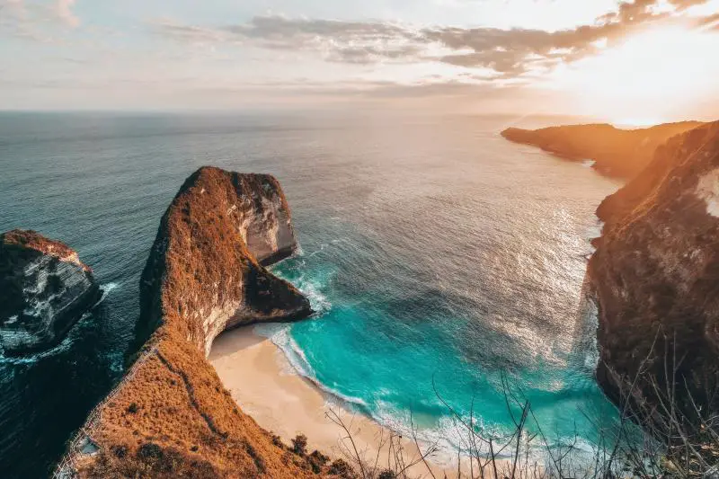 Nusa Penida's Kelingking Beach at sunset.