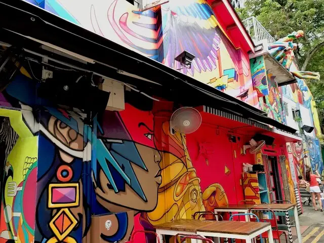 Bright and colorful street art in Kampong Glam's Haji Lane in Singapore.
