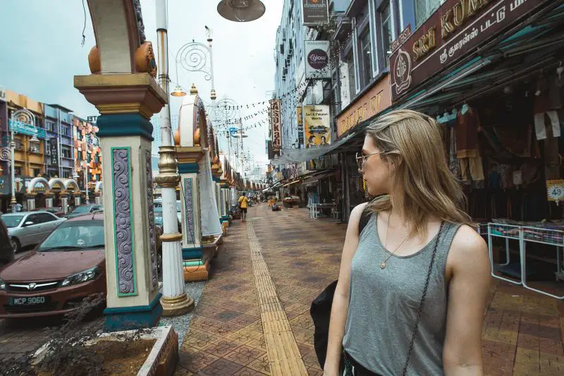 Woman exploring the streets of Little India's Brickfields area in Kuala Lumpur, Malaysia