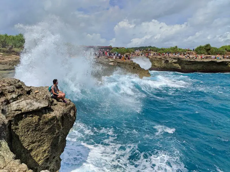 Watching the waves splash against the cliffs on Devil's Tear in Nusa Lembongan, Indonesia