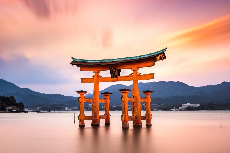 The floating torii gate, Otorii, in Miyajima, Japan with the sunset.