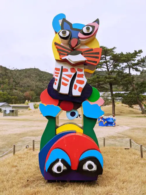 It's a colorful cat and frog sculpture in the Benesse House Outdoor artwork area on Naoshima, Japan.