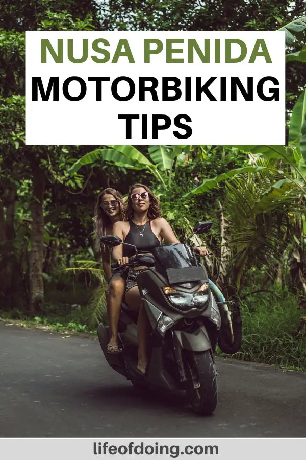 Two women ride a motorbike on a paved road in Nusa Penida, Indonesia. This post highlights motorbiking tips on Nusa Penida.