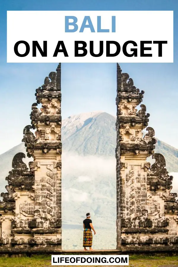 A man standing in the Lempuyang Temple's Gateway to Heaven in Bali, Indonesia