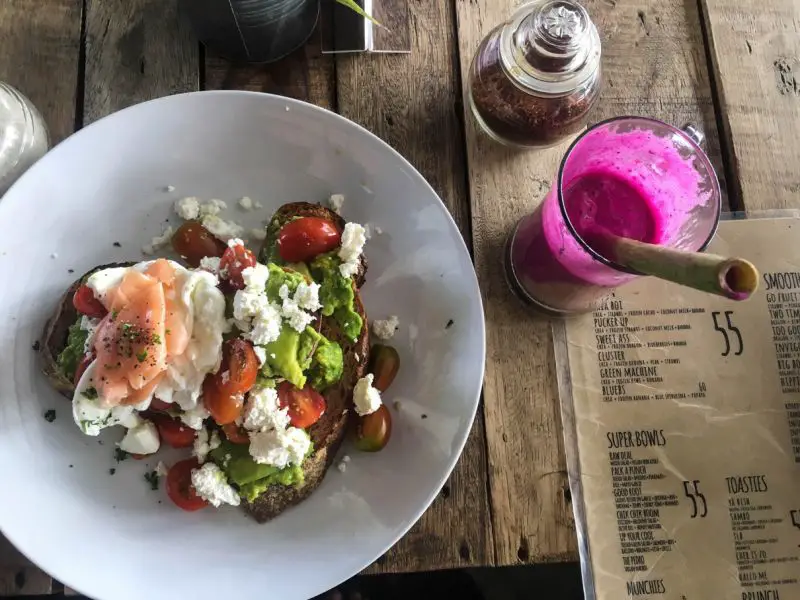 Avocado toast with cheese and smoked salmon and fresh juice