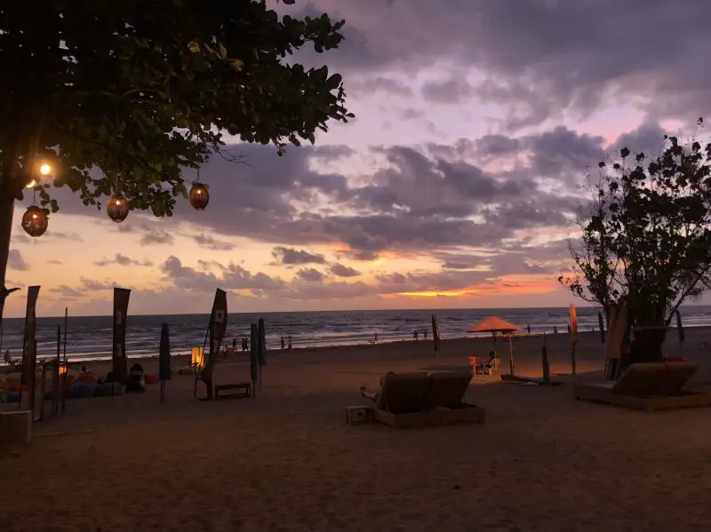 Sunset with purple skies from the beach at Moonlite Kitchen and Bar in Bali