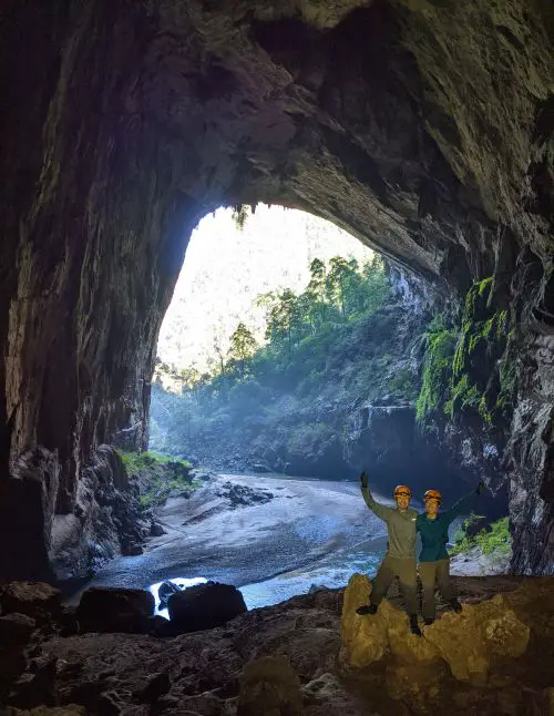 Justin Huynh and Jackie Szeto, Life Of Doing, pose inside the Hang En Cave which leads to a valley.