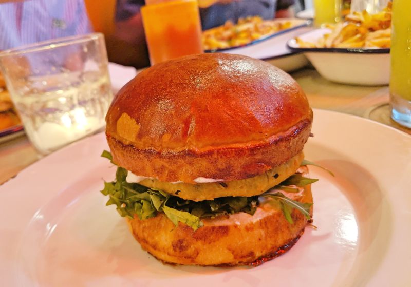 Vegetarian burger with falafel patty and arugula at Marcel Burger in Ho Chi Minh City