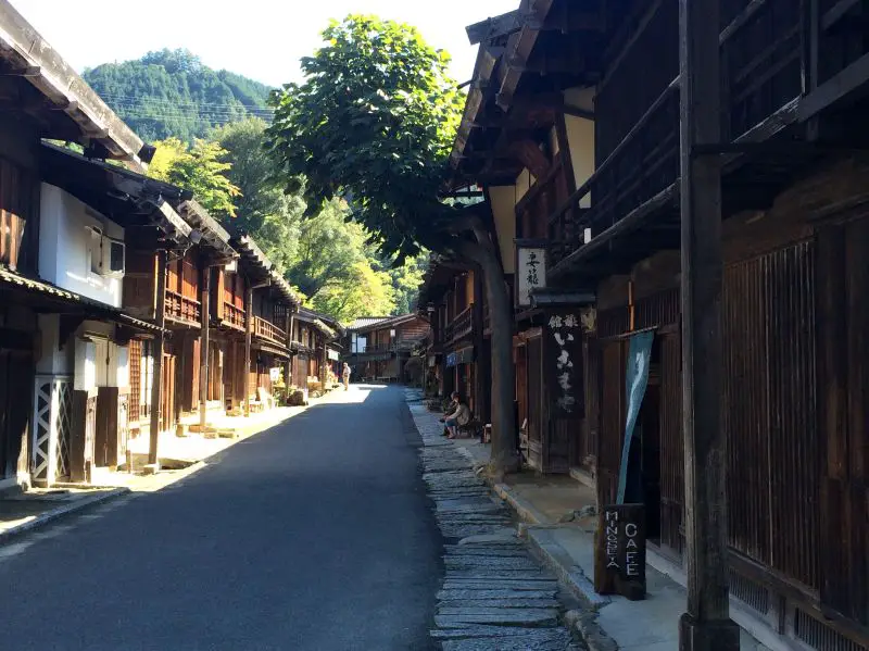 Walk through towns to see traditional Japanese housing when hiking Magome to Tsumago Trail.