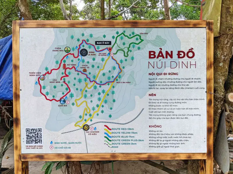 A map of the Nui Dinh Mountain hiking trail with red, yellow, blue, and green lines representing the different routes