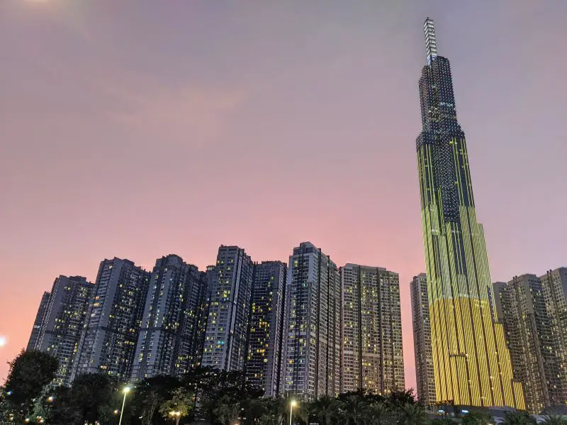 Visit Landmark 81, one of the top things to do in Ho Chi Minh City, Vietnam, to see high rises with the pink and purple skies during sunset
