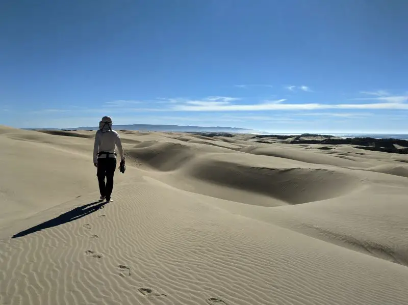 Justin Huynh, Life Of Doing, walks on the sand dunes and overlooking the Pacific Ocean and more dunes at Oceano Sand Dunes, California