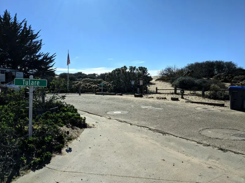A paved road leads to the entrance of the Oceano Dunes.