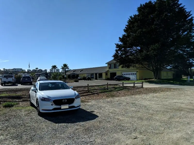 Dirt parking lot in front of the Pacific Dunes Ranch RV Resort to access Oceano Dunes.