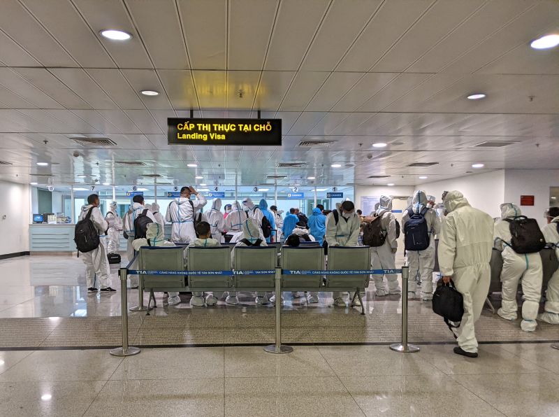 People waiting in line for the visa on arrival area at the Tan Son Nhat International Airport.
