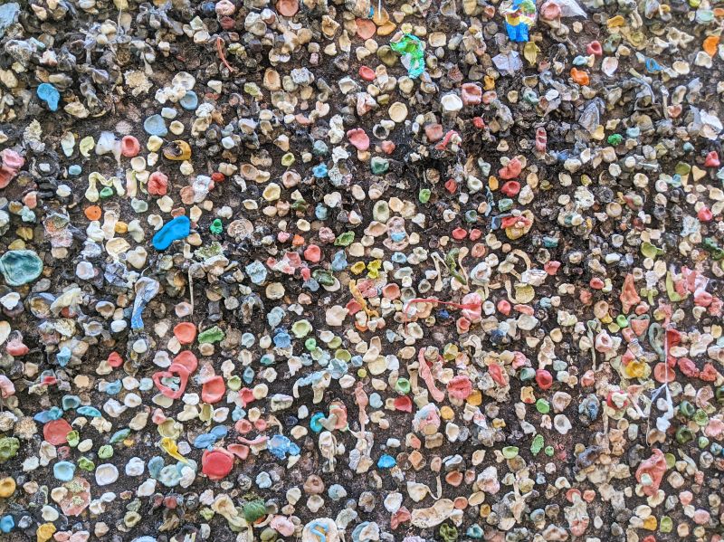 Close up of chewed up bubble gums on the wall at Bubblegum Alley in San Luis Obispo, California