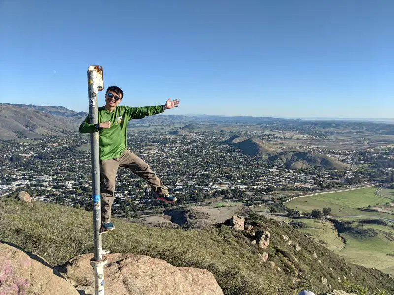 Justin Huynh, Life Of Doing, stand on the pole on the top of Mount Madonna Peak in San Luis Obispo, California