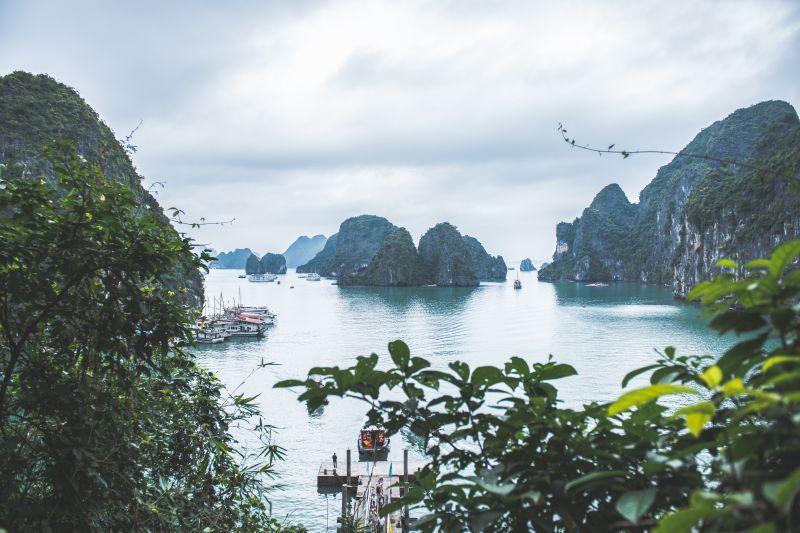 View of white boats and the limestone karsts in Halong Bay, Vietnam