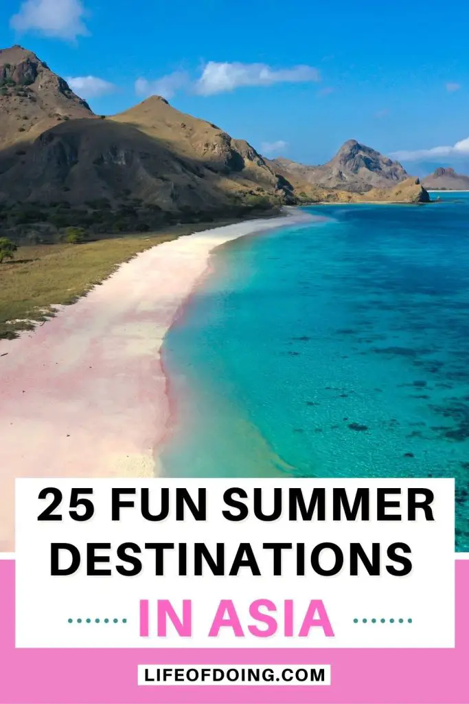 A pink sandy beach next to mountains and blue ocean in Komodo National Park, Indonesia, one of the best places to visit in Asia during the summer season.