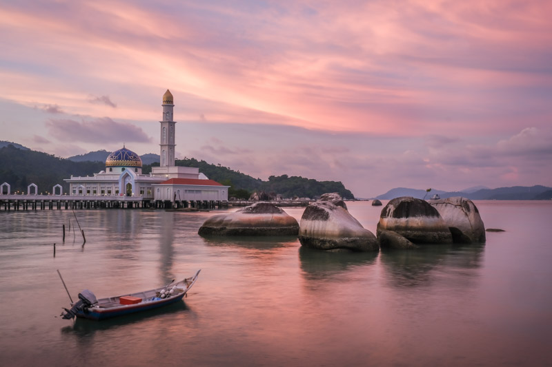 Purple and orange sunset shining over the floating mosque in Pangkor Island, Malaysia