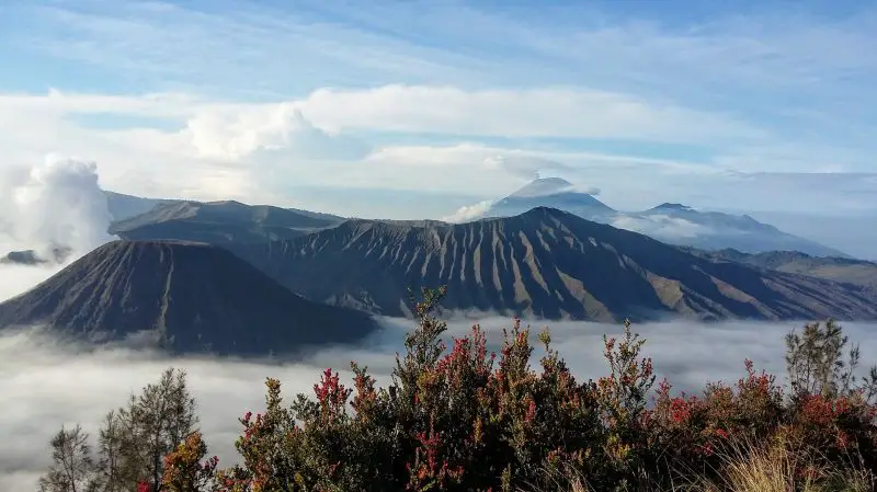 A layer of fog surrounds the Mount Bromo volcano caldera in Indonesia