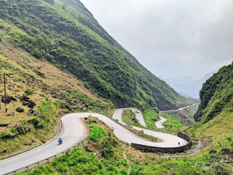 A car and motorbike ride along Tham Ma Pass, a snake-like road.