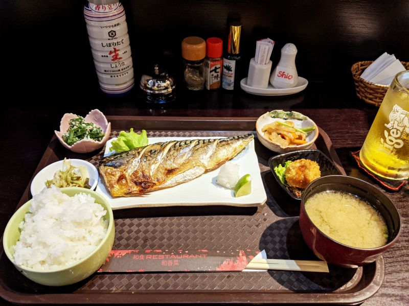 A piece of grilled mackerel with rice, miso soup, and four side dishes at Wakana Restaurant, Ho Chi Minh City, Vietnam