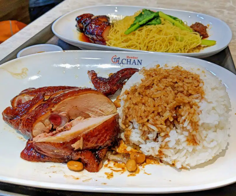 Soy sauce chicken with rice and yellow noodles with BBQ pork and vegetables at Hawker Chen, Singapore