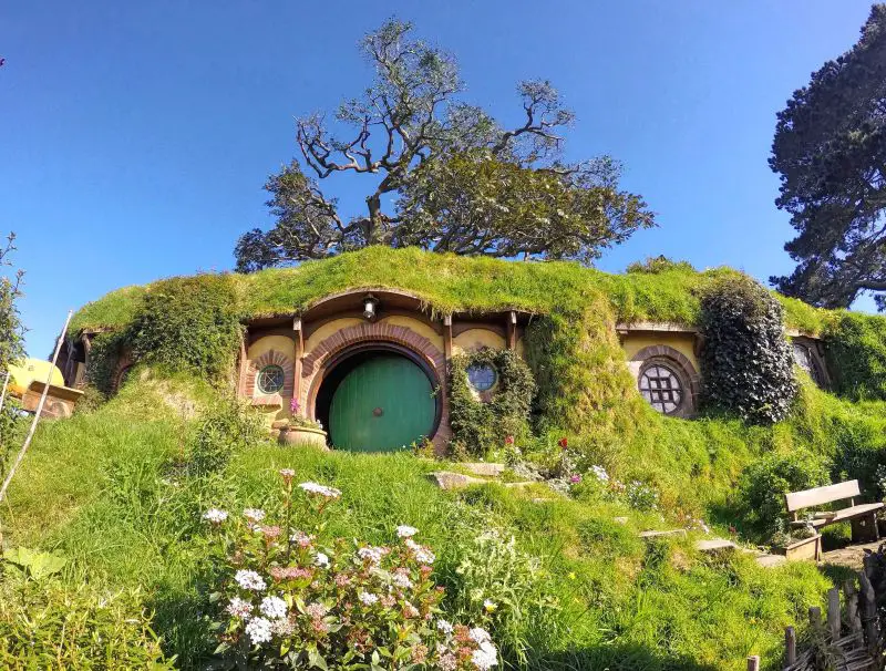 A Hobbit hole with a green door, which is Bag Ends, at Hobbiton Movie Set
