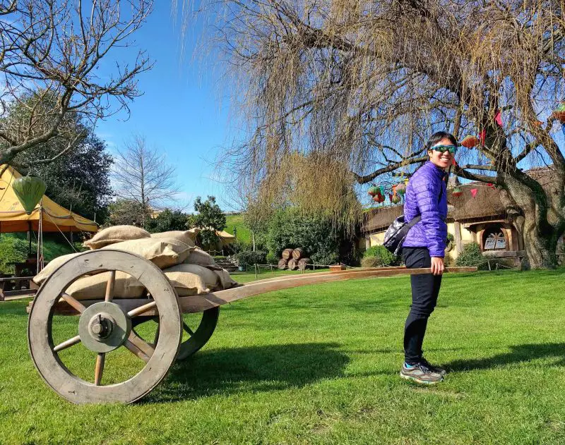 Jackie Szeto, Life Of Doing, lifting a wheelbarrow at Hobbiton Movie Set