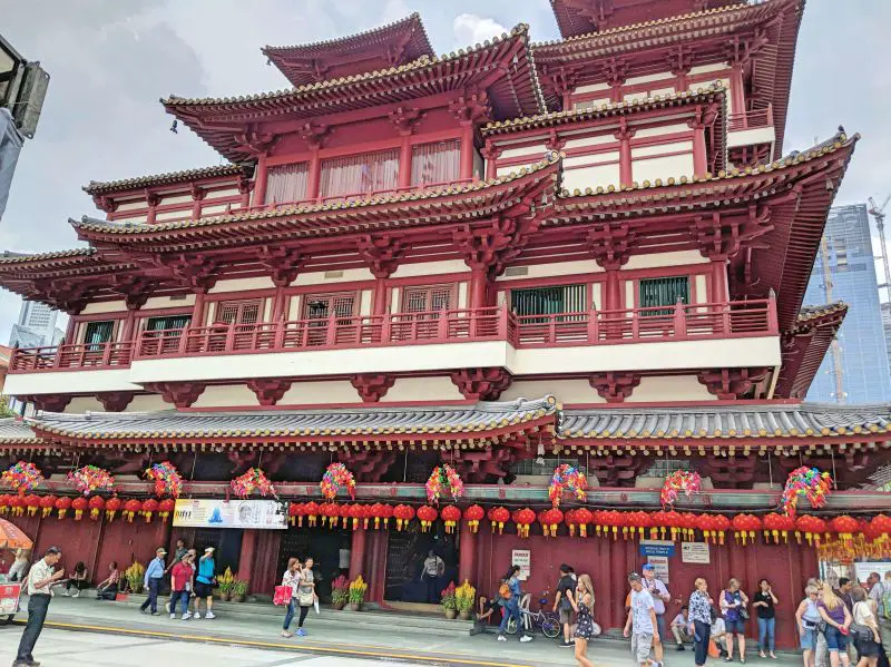 Buddha Tooth Relic Temple and Museum is a red and white building with Chinese architecture.