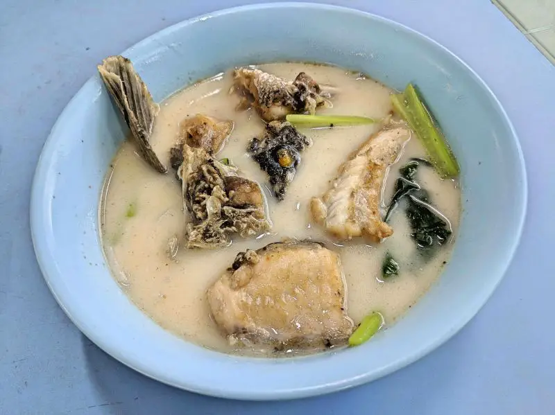 A bowl of fish meat and bones in a milky soup at Anji Fish Noodle, Singapore Chinatown Complex