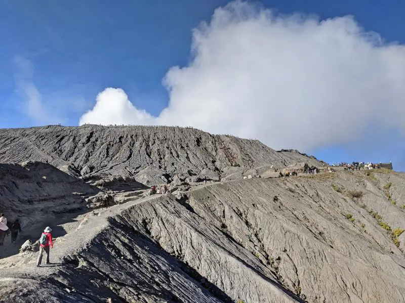 Jackie Szeto, Life Of Doing, climbs the dirt path to reach Mount Bromo crater