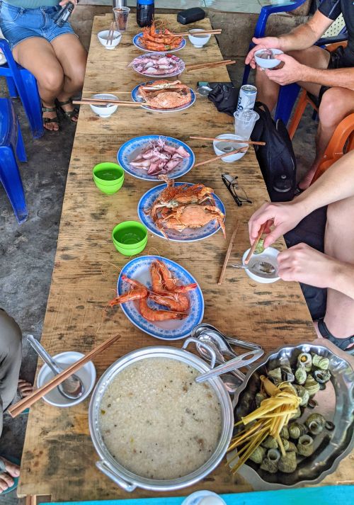 A seafood lunch of crab, squid, shelled seafood, and sea urchin porridge