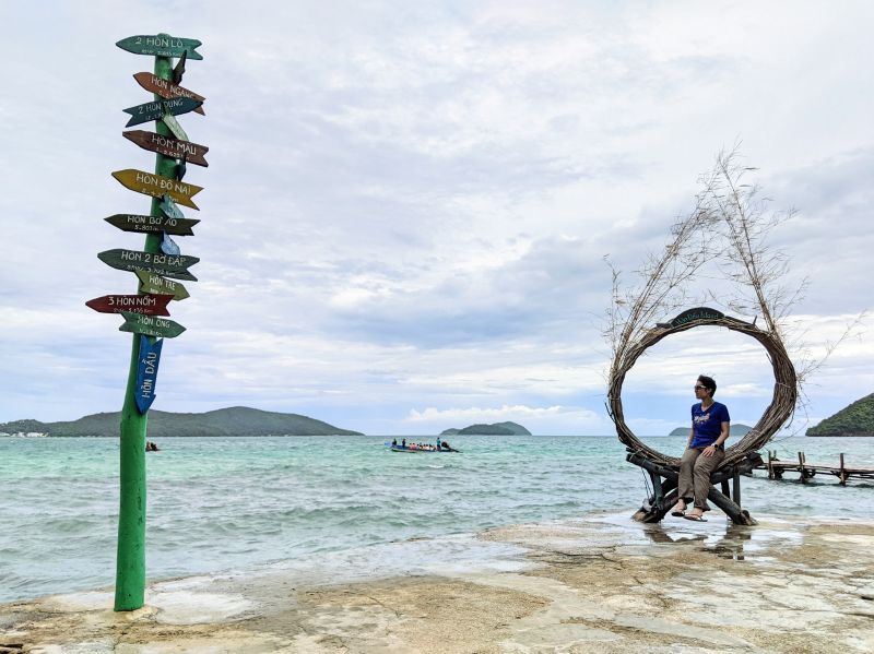 Jackie Szeto, Life Of Doing, sits on a bird nest and overlooking the waters on Hon Dau, Nam Du Island