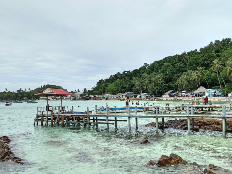 A port and green waters of Hon Mau Island, a part of Nam Du Island.