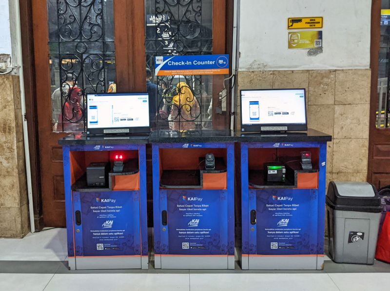 Two kiosks with computers to redeem the e-ticket train to physical tickets at Surabaya Gubeng train station