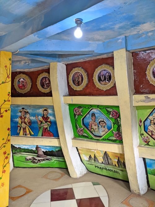 Paintings inside the Chicken Church highlighting Indonesia culture and landmarks