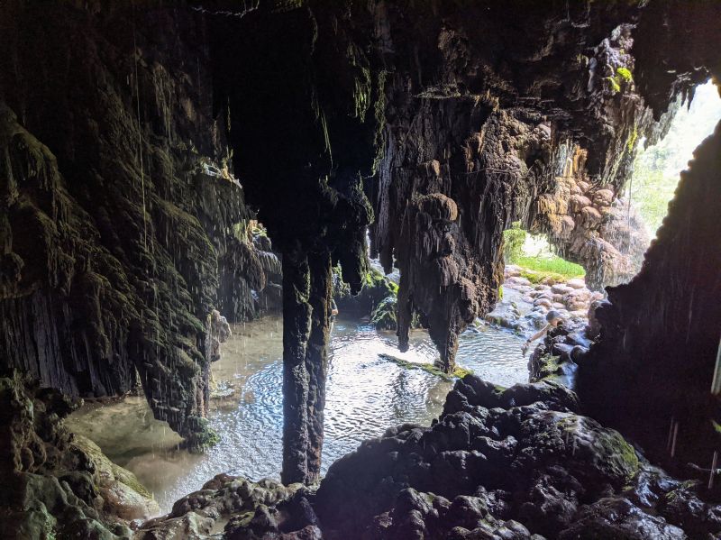 Inside the Tetes Cave with limestone rocks inside a pool of water