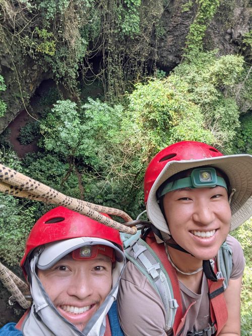 Justin Huynh and Jackie Szeto, Life Of Doing, hang by ropes and harnesses before heading down into the Jomblang Cave