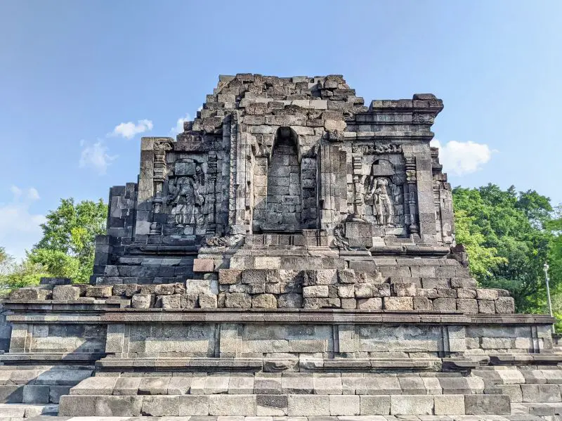 Lumbung Temple at Prambanan Temple Complex has stone walls and restored statues