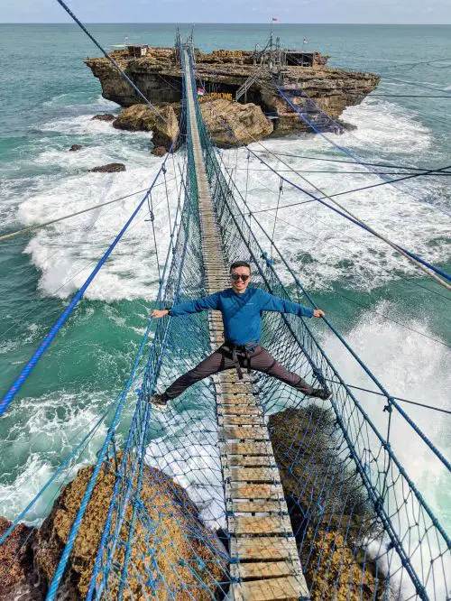 Justin Huynh, Life Of Doing, does a partial splits on the Timang Beach suspension bridge, Indonesia