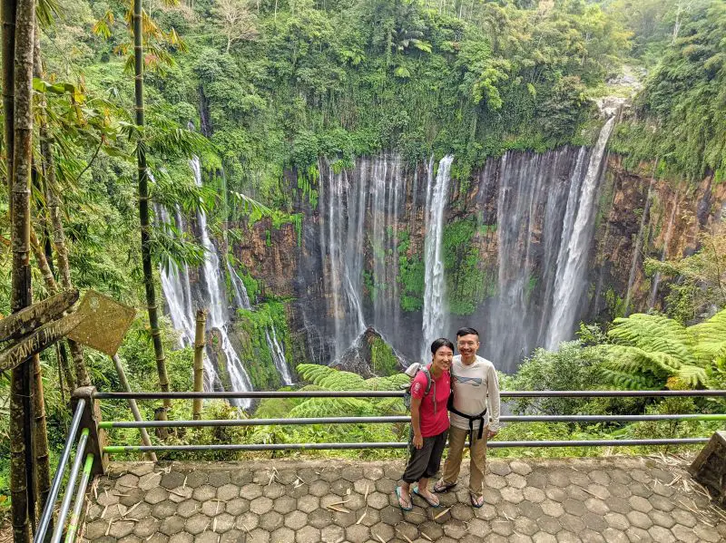 Jackie Szeto and Justin Huynh, Life Of Doing, stand on the overlook area of Tumpak Sewu Waterfall