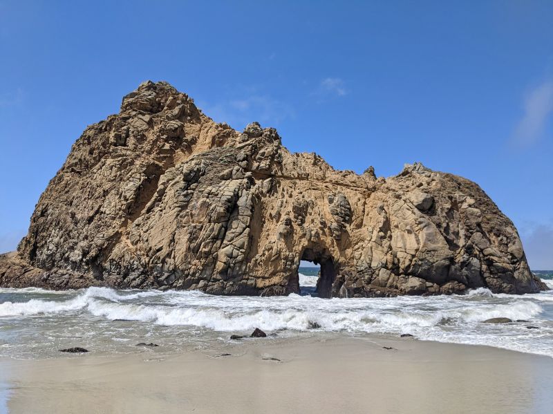 Keystone Arch at Pfeiffer Beach is a giant rock with a hole as an archway