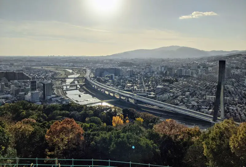 A city view of the bridge and waterway from Shubodai Observatory Point, nearby the Satsukiyama Zoo in Ikeda, Japan