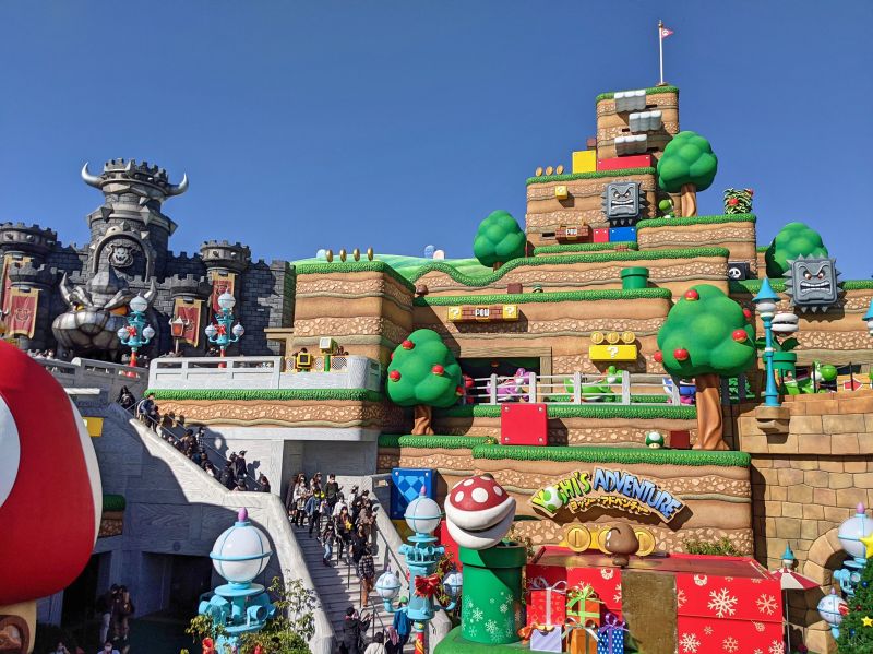 View of Bowser's grey castle and Yoshi's Adventure ride at Super Nintendo World, Universal Studios Japan