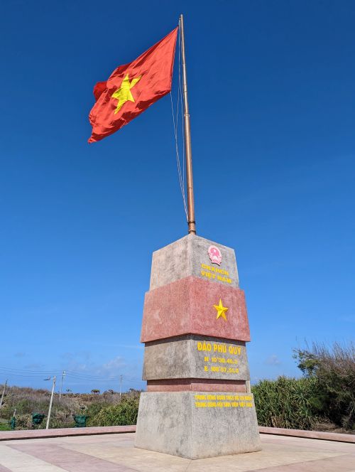 A Vietnam flag on a the Phu Quy flagpole